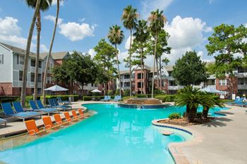 Expansive oasis-style pool with tanning ledge